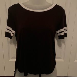 black t-shirt with white stripes on the sleeves